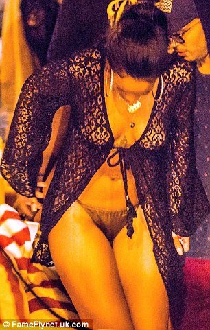 Braless Rihanna sexy eyeful as she parties in just bikini bottoms and a sheer top aboard mega yacht in the Caribbean