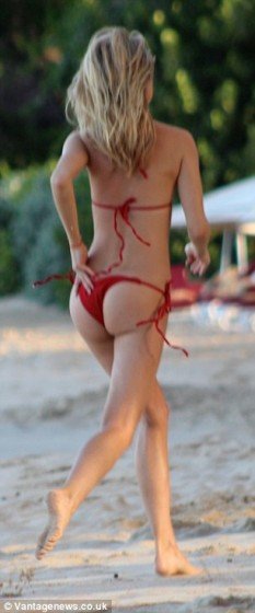 Kimberley Garner red bikini on the beach pic 2