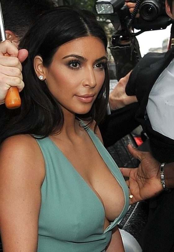 Kim Kardashian braless in plunging dress