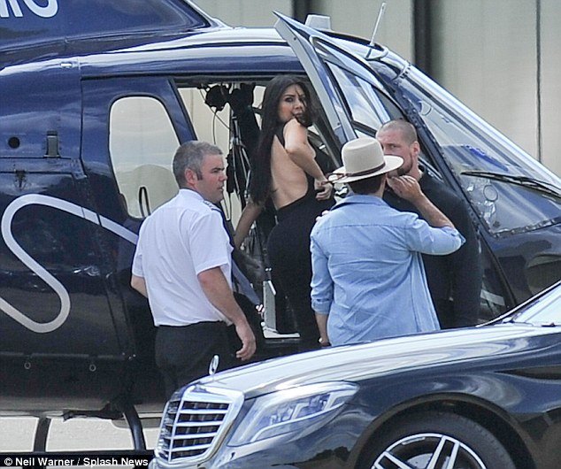 Kim Kardashian braless sheer dress