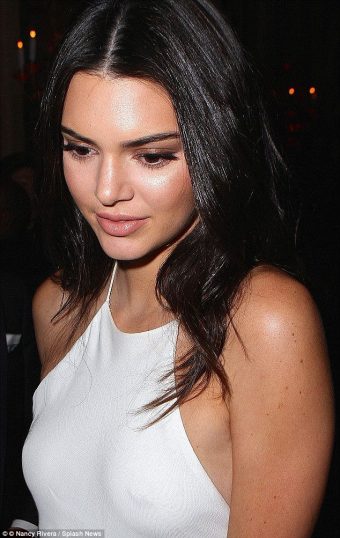Kendall Jenner beautiful young celebrity with nipple piercing in braless dress