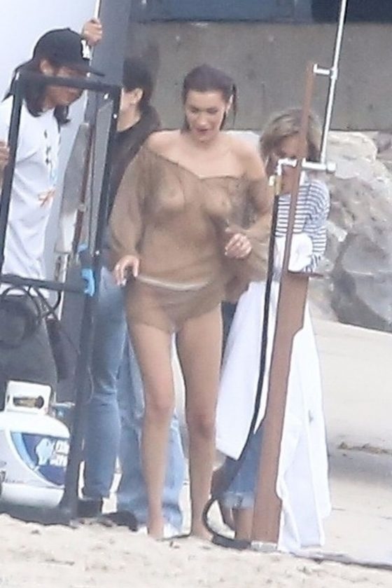 Bella Hadid leaves little to the imagination wearing a sheer blouse and matching bottoms for bikini photo shoot