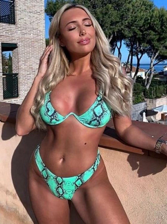 TOWIE’s Amber Turner showcases her ample assets in turquoise snake print bikini during Marbella getaway