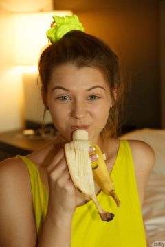 sexy girl with banana in her mouth