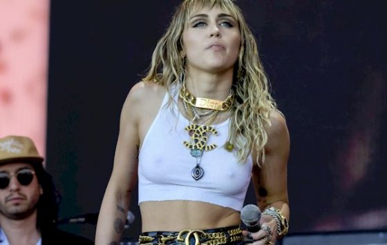 Miley Cyrus Pokies in white See-Through crop top at Glastonbury Festival!