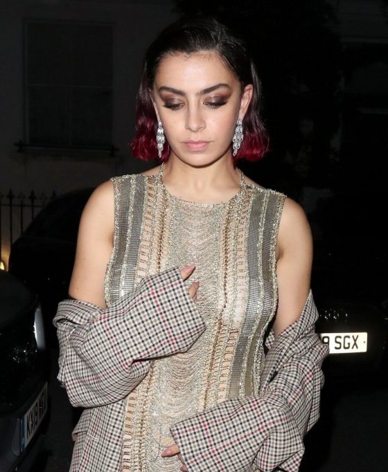 Charli XCX goes braless in racy gold knitted dress as she was leaving the GQ Men Of The Year Awards afterparty (10 photos) 31 sexy celebrity singer Charli-XCX braless see through mini dress candid 1