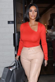 Braless Kim Kardashian debuts her sleek new bob as she goes Christmas shopping