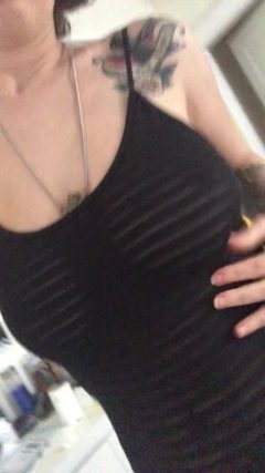 amateur wife with big tits wearing black see-through dress