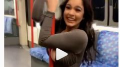 busty girl with sexy revealing dress trying pole dancing in the subway