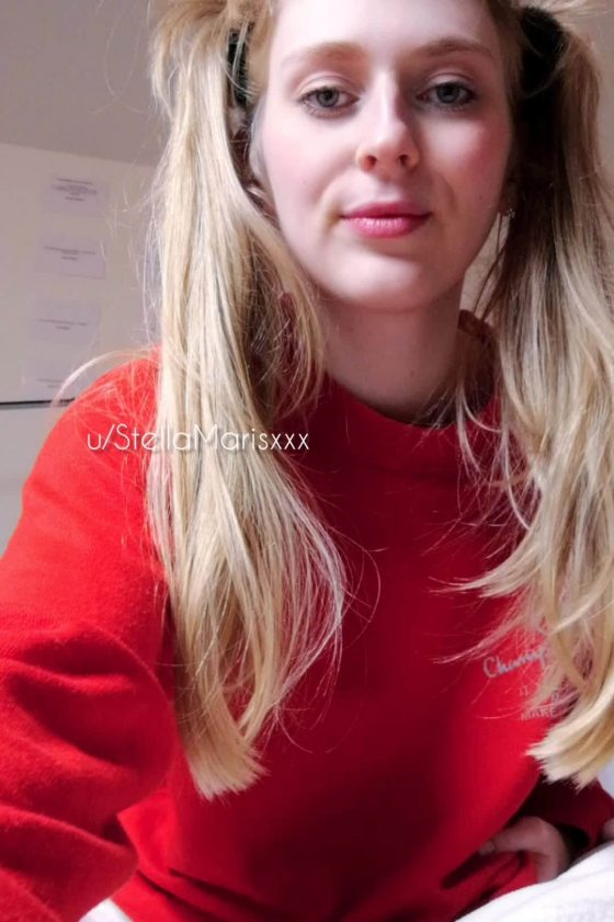 Blonde chick shows off her tits under red sweater (gif)