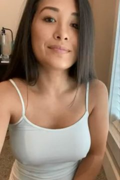 Cute Asian girl with big tits wearing a white tank top