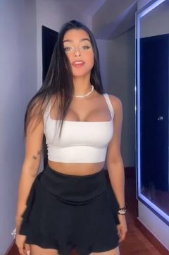 beautiful girl with boobs in crop top and mini skirt