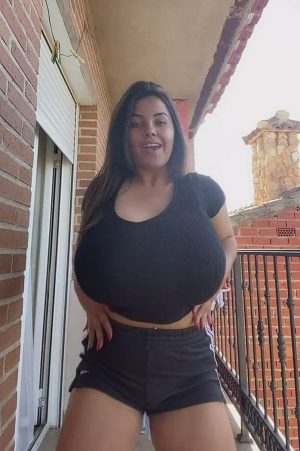 curvy girl with huge boobs in tight blouse