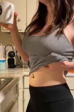 hot fit woman drinks coffee