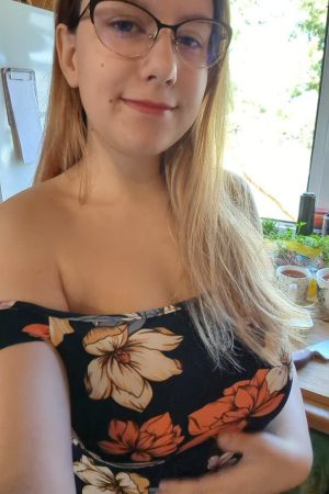 busty amateur girl with glasses and big tits in floral dress