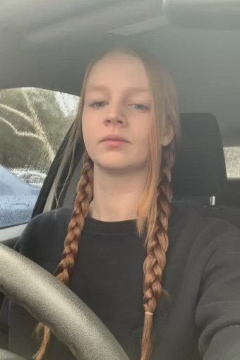 sexy redhead inside the car