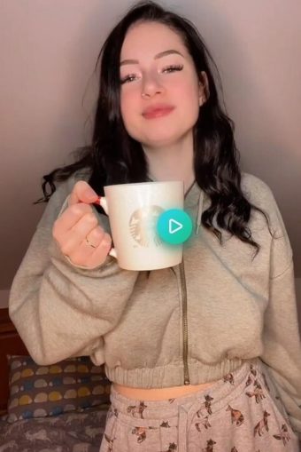 beautiful braless girl drinks coffee