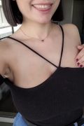 smiling girl with big natural tits in braless top