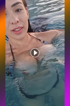 girl flashes her sexy tits out of the bikini top in the water