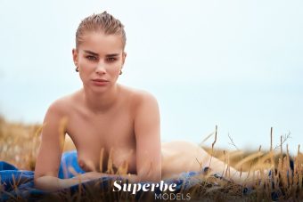 sensual model topless at the beach