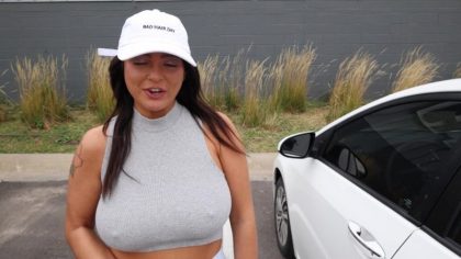 Large breasts with big nipples flashed in the parking (video)