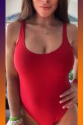 hot busty woman in red bodysuit