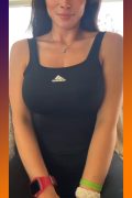 lovely woman with big tits in black sporty outfit