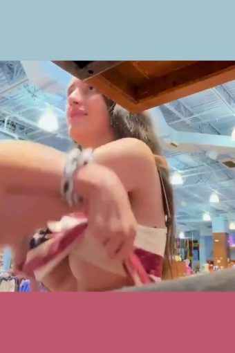 busty real girl gets topless in a public place