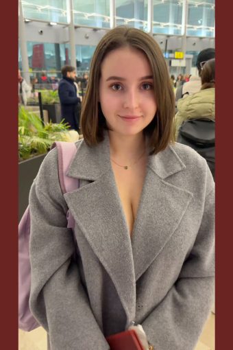 cute girl with nude boobs under the coat