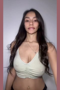 busty amateur woman poking big nipples in braless top