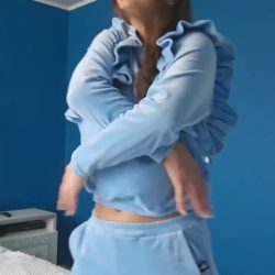 hot busty fit girl strips her athletic outfit off