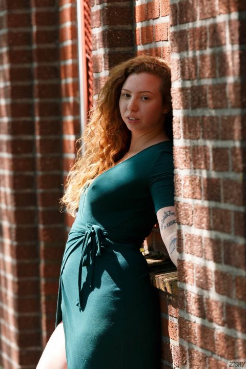 sexy redhead poking braless dress