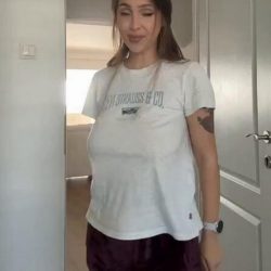 busty tattooed babe getting undressed at home in a homemade nsfw scene