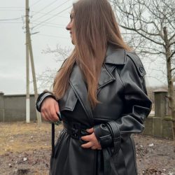 busty brunette naked under leather coat outdoors