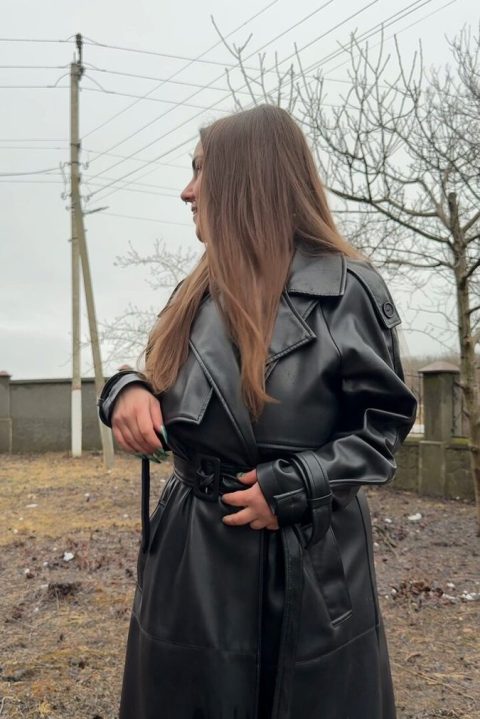 busty brunette naked under leather coat outdoors