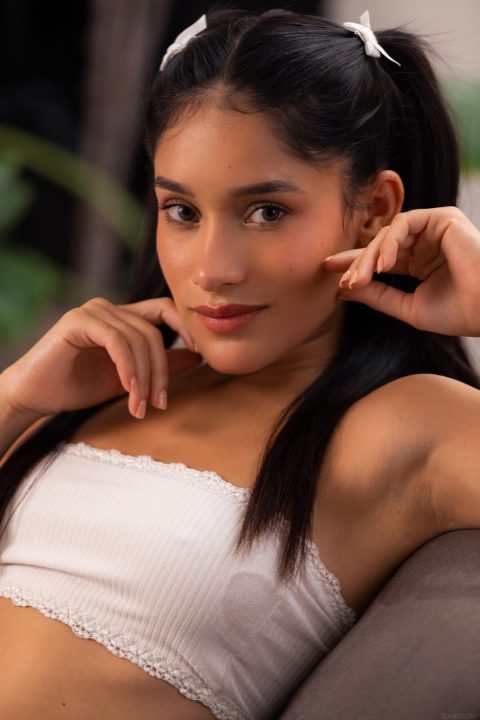 cute colombian girl with pigtails and crop top