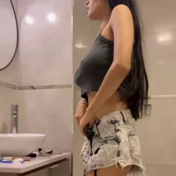 braless slim amateur brunette with big tits teasing in bathroom striptease video