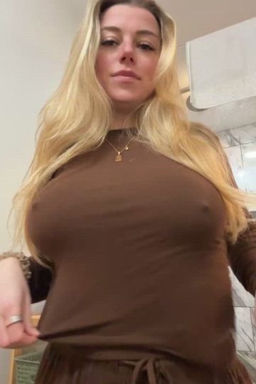 Busty real amateur shows her bare boobs under braless blouse