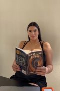 beautiful amateur girl with big boobs reading a book
