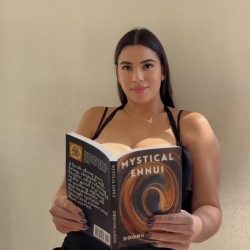 beautiful amateur girl with big boobs reading a book
