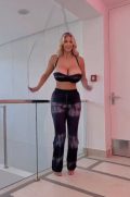 Beautiful tall woman jumping rope in high heels and a plunging top, showcasing the rhythmic bouncing of her big boobs to dance music in a high-quality NSFW reel.
