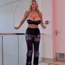Beautiful tall woman jumping rope in high heels and a plunging top, showcasing the rhythmic bouncing of her big boobs to dance music in a high-quality NSFW reel.