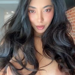 Exotic busty beauty with long dark hair performing a nude TikTok dance in a high-quality NSFW homemade video selfie.