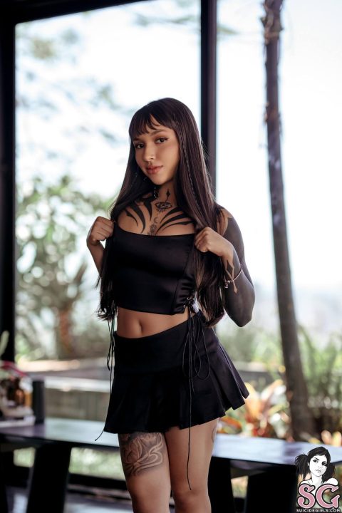 alt-indie model black crop-top and mini skirt