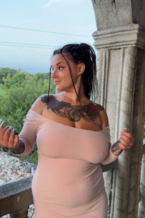 Chubby tattooed girl flashing large breasts - premium poster
