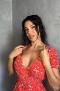 Sexy woman opens her braless dress to reveal her big tits - full HD screenshot