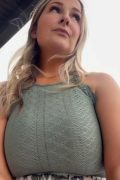 Attractive amateur MILF stepping onto her private backyard porch, glancing over her shoulder under open daylight.