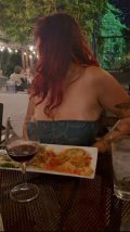 Red-Haired Babe Flashes Big Tits from Strapless Dress at Dinner - full HD screenshot