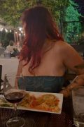 Red-Haired Babe Flashes Big Tits from Strapless Dress at Dinner - full HD screenshot