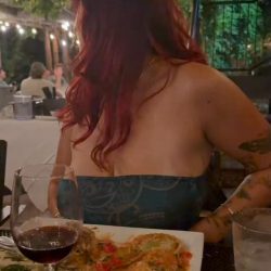 Red-Haired Babe Flashes Big Tits from Strapless Dress at Dinner - full HD screenshot